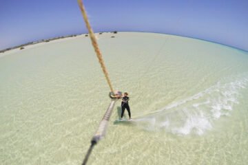 Kitesurfing with mangrove trees in the back
