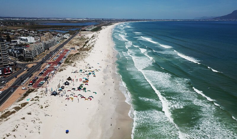 Aerial view of Kite Beach in Cape Town, South Africa with kites